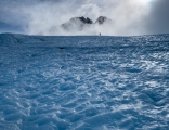 Blue ice and climber, Hooker Glacier